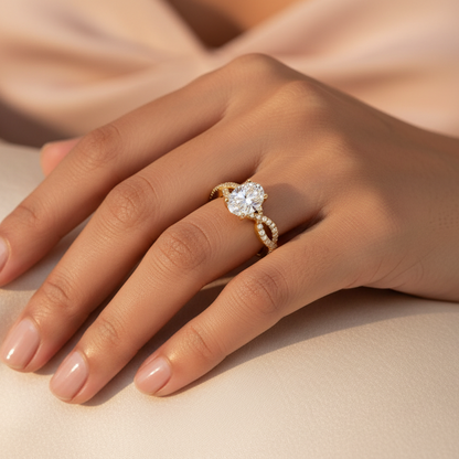 Generated image of a beautiful Indian female model wearing the yellow gold oval-cut diamond solitaire engagement ring with four-claw setting and spectacular split infinity twist pavé diamond shank with two slim crossing pavé diamond rails on each shoulder creating beautiful X-shaped crossover infinity twist pattern