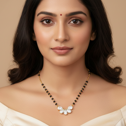 Generated image of a beautiful Indian married female model wearing the yellow gold five pear-cut diamond fan butterfly wing cluster mangalsutra with five pear-cut diamonds fanning outward in a beautiful symmetrical floral butterfly wing pendant on a traditional black bead and yellow gold chain