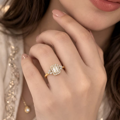 Close-up of a hand wearing a diamond ring with a blurred background