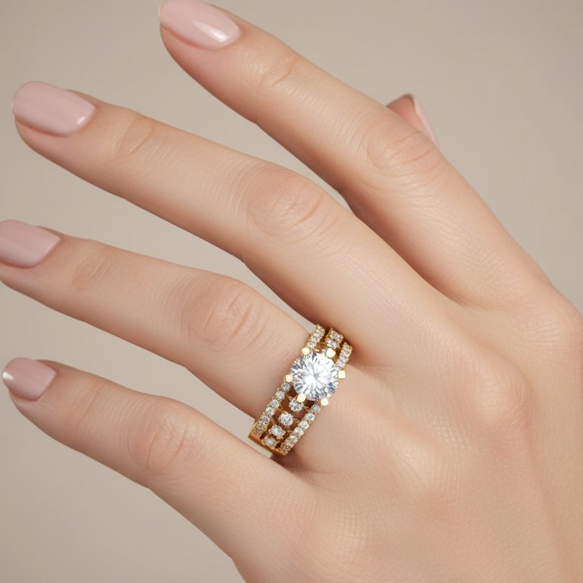 Generated image of a female model wearing the yellow gold six-prong solitaire ring with open lattice triple-row diamond band