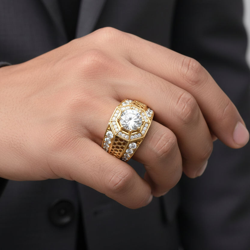 Generated image of a handsome Indian male model wearing the yellow gold hexagonal honeycomb lattice statement ring with large round brilliant diamond solitaire centre and triple-row diamond shank