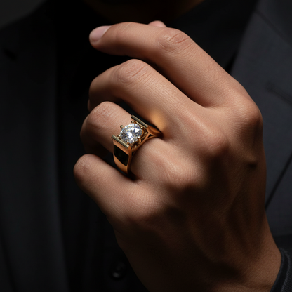 Hand wearing a gold ring with a diamond on a dark background