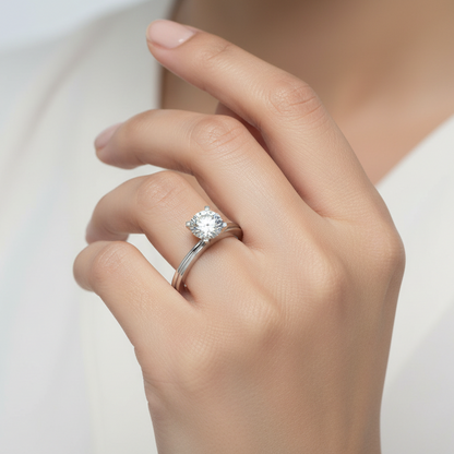 Generated image of an Indian female model wearing the white gold four-prong square flat-tip round brilliant solitaire engagement ring with distinctive grooved flat-edge band
