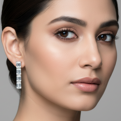 Generated image of an Indian female model wearing the white gold four-stone emerald-cut diamond linear drop earrings