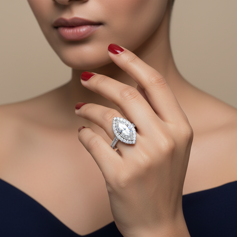 Generated image of an Indian female model wearing the white gold marquise-cut diamond halo engagement ring with spectacular large round brilliant diamond halo and large round brilliant diamond pavé shank