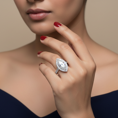 Generated image of an Indian female model wearing the white gold marquise-cut diamond halo engagement ring with spectacular large round brilliant diamond halo and large round brilliant diamond pavé shank