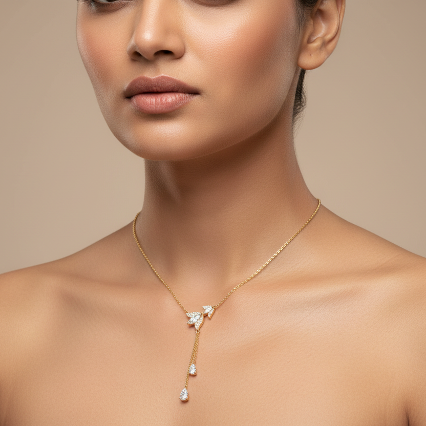 Generated image of an Indian female model wearing the yellow gold botanical leaf and diamond lariat Y-drop necklace