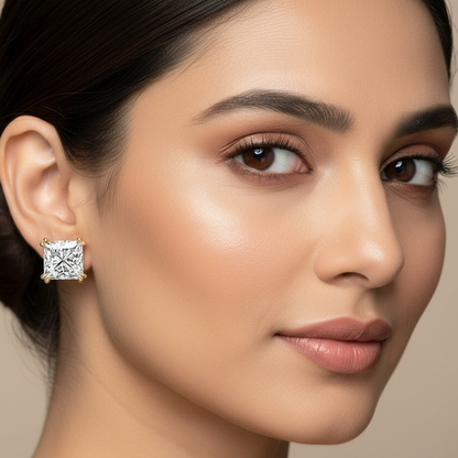 Generated image of an Indian female model wearing the yellow gold double-prong princess-cut diamond solitaire stud earrings