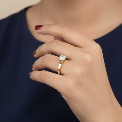Generated image of an Indian female model wearing the yellow gold four-claw round brilliant diamond solitaire engagement ring with wide flat-sided double-groove architectural shank