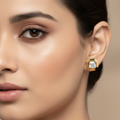 Generated image of an Indian female model wearing the yellow gold octagonal frame radiant-cut diamond solitaire stud earrings