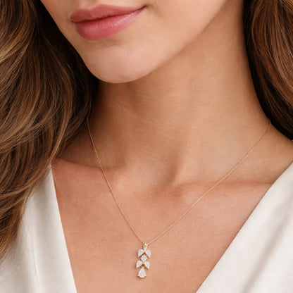 Necklace with a pendant worn by a person in a white top