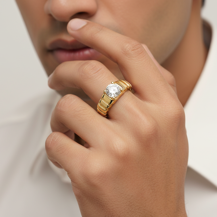 Generated image of an Indian male model wearing the yellow gold four-prong round brilliant solitaire ring with bold ribbed ridged architectural band