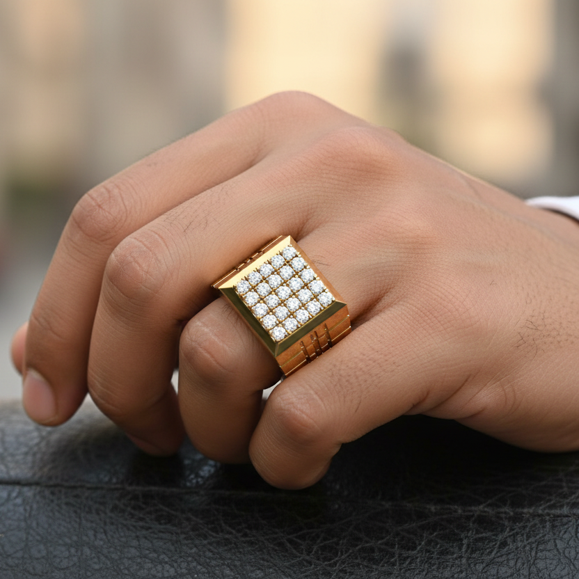 Hand wearing a gold ring with gemstones on a blurred background