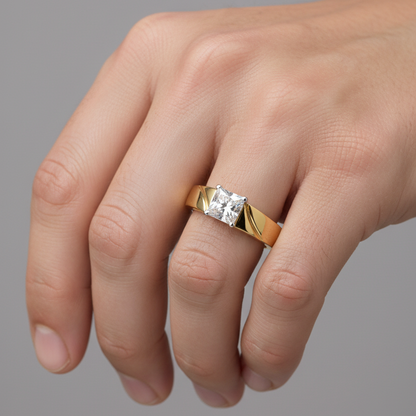 Male model wearing yellow gold princess-cut diamond solitaire ring with sculptural twist band