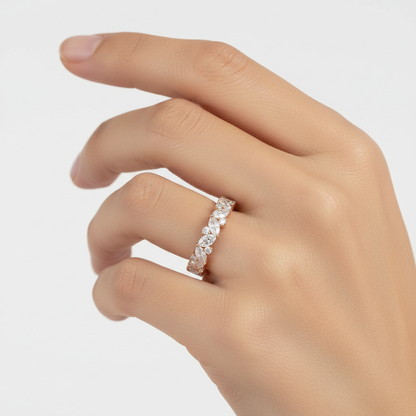 Rose gold marquise and round diamond eternity band on model