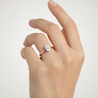 Rose gold oval diamond solitaire engagement ring on model