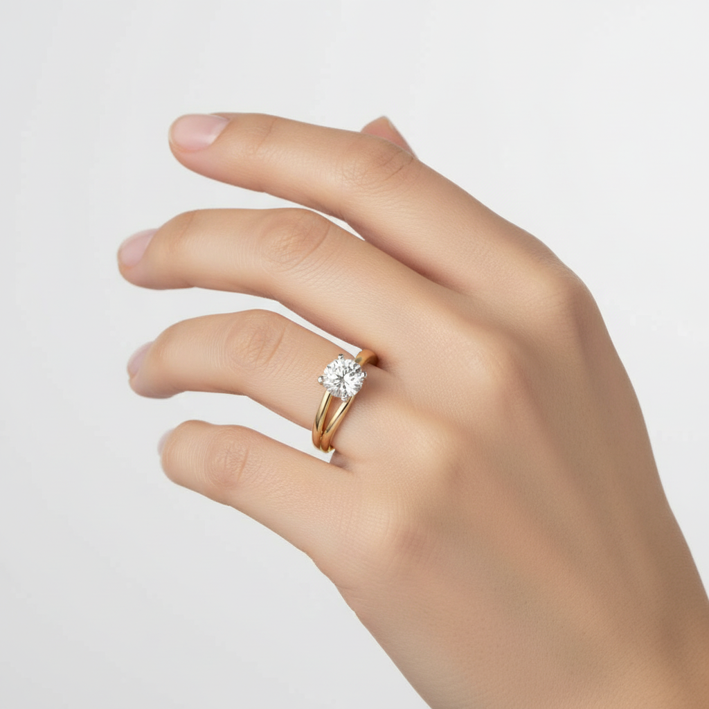 Two-tone gold round brilliant diamond solitaire engagement ring with twisted band on model