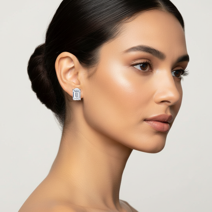 White gold emerald-cut diamond stud earrings on model