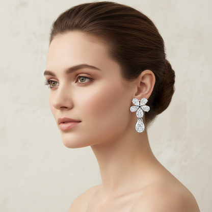 White gold pear-shaped diamond flower drop earrings on model