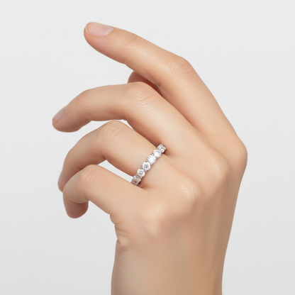 White gold round brilliant diamond eternity band on model