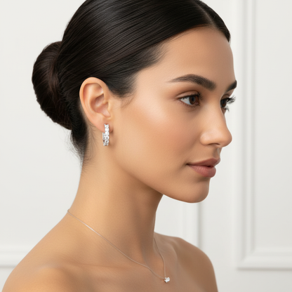 White gold round brilliant diamond hoop earrings on model