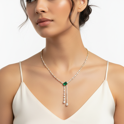 Yellow gold diamond and emerald Y-drop necklace on model