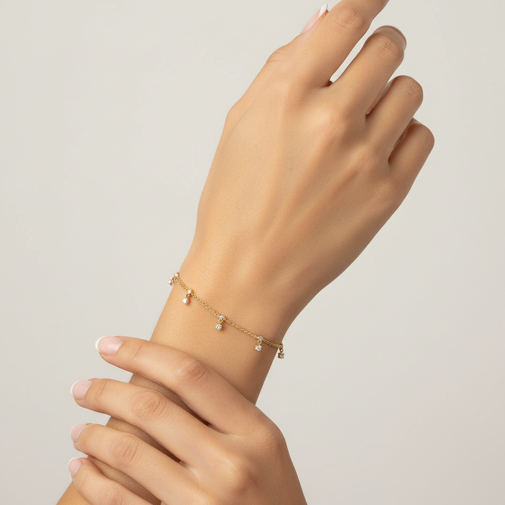 Yellow gold diamond charm bracelet on model