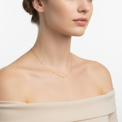 Yellow gold diamond station necklace on model