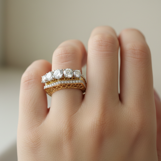 Yellow gold five-stone diamond ring with lattice gallery and pavé accents on model