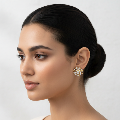 Yellow gold floral starburst diamond stud earrings on model