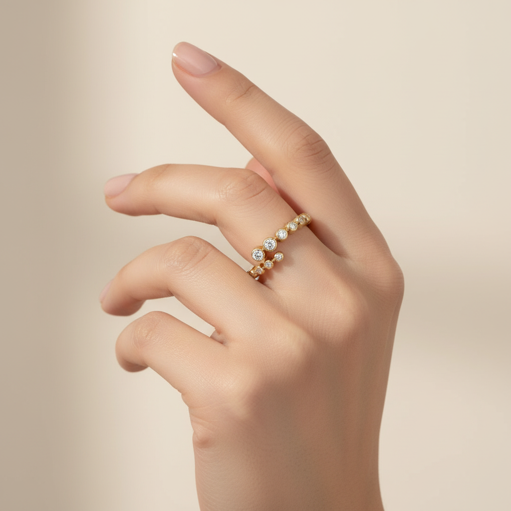 Yellow gold graduated diamond stackable ring on model