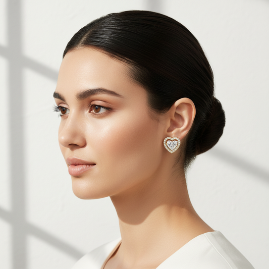 Yellow gold heart-shaped diamond halo stud earrings on model