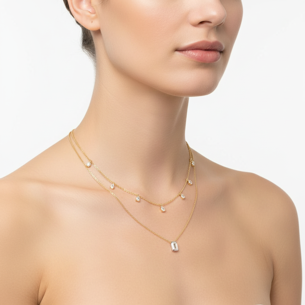 Yellow gold layered diamond necklace on model