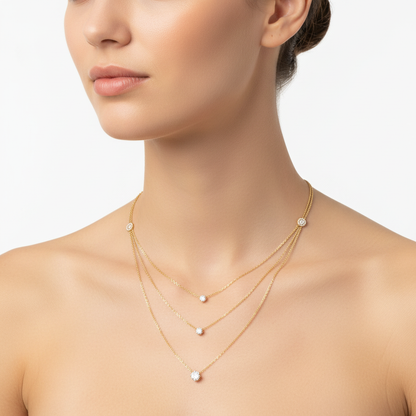 Yellow gold layered diamond necklace on model