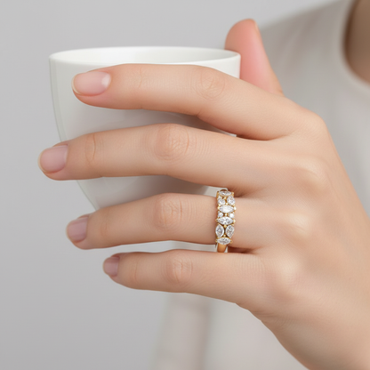 Yellow gold mixed-cut diamond anniversary band with marquise and round brilliant diamonds on model