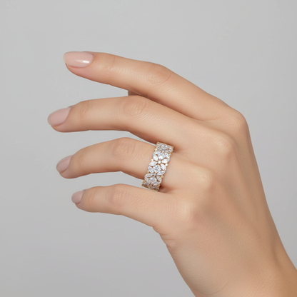 Yellow gold mixed-cut diamond floral cluster eternity band on model