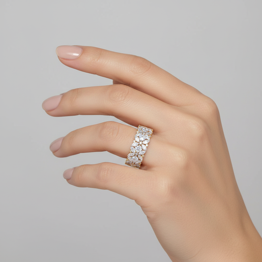 Yellow gold mixed-cut diamond floral cluster eternity band on model