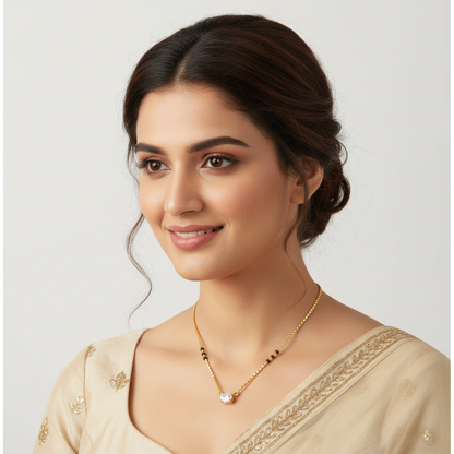 Yellow gold oval diamond mangalsutra with black bead accents on model