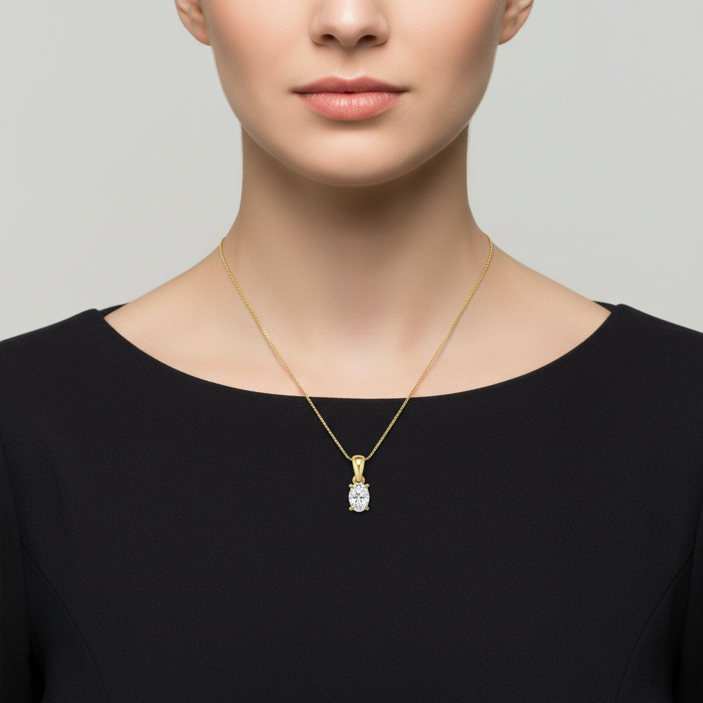 Yellow gold oval diamond solitaire pendant on model