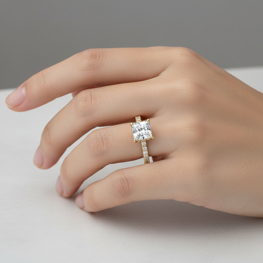 Yellow gold princess-cut diamond engagement ring with hidden halo and pavé band on model