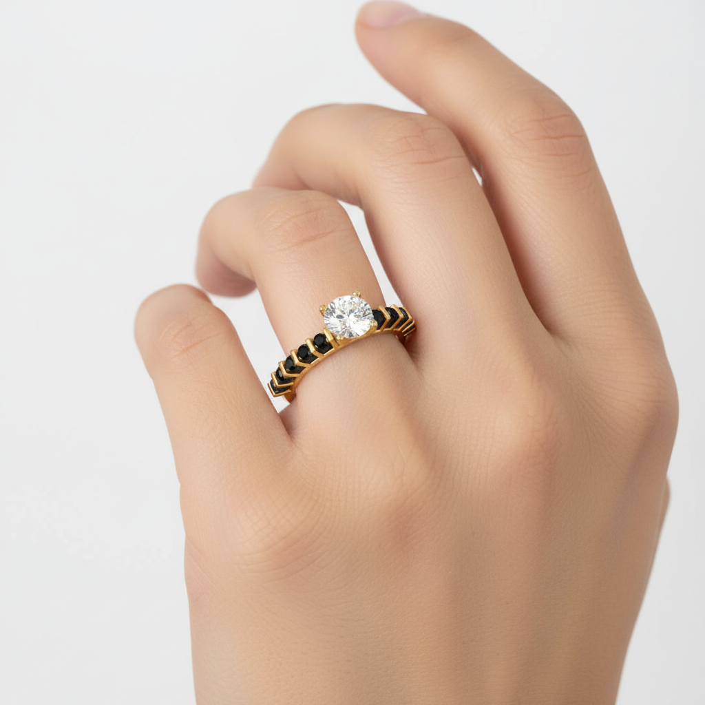 Yellow gold round brilliant diamond engagement ring with black diamond accents on model