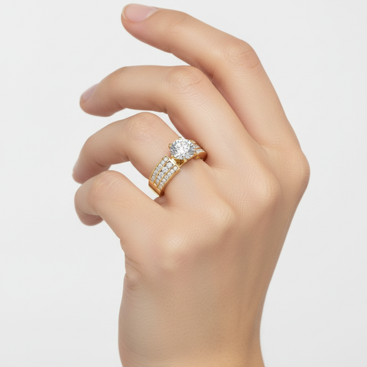 Yellow gold round brilliant diamond engagement ring with triple-row channel-set pavé band and decorative gallery on model