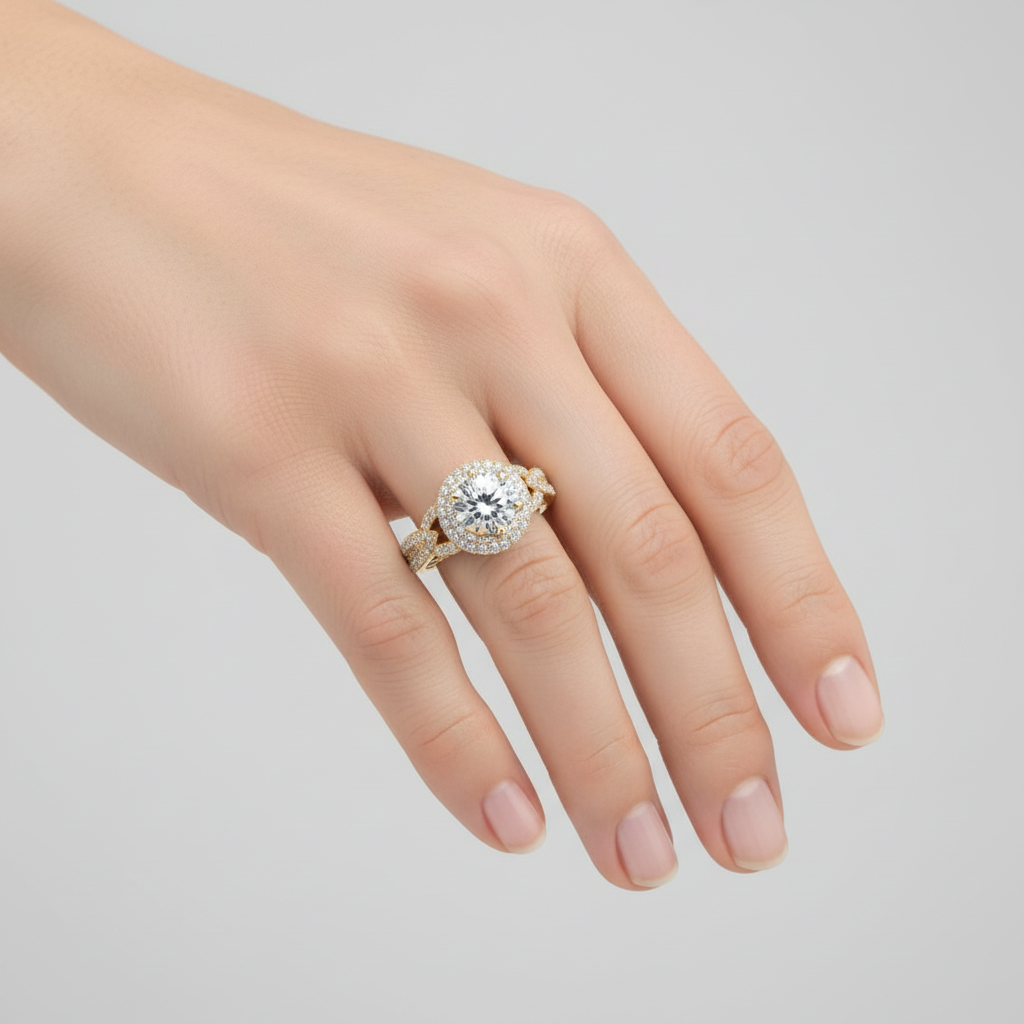 Yellow gold round brilliant diamond halo engagement ring with ornate filigree and pavé band on model