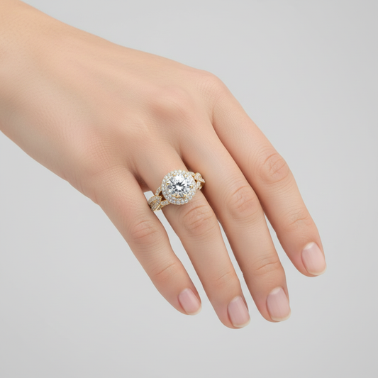 Yellow gold round brilliant diamond halo engagement ring with ornate filigree and pavé band on model