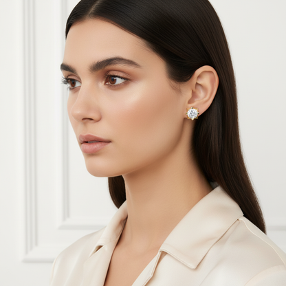 Yellow gold round brilliant diamond stud earrings with geometric settings on model